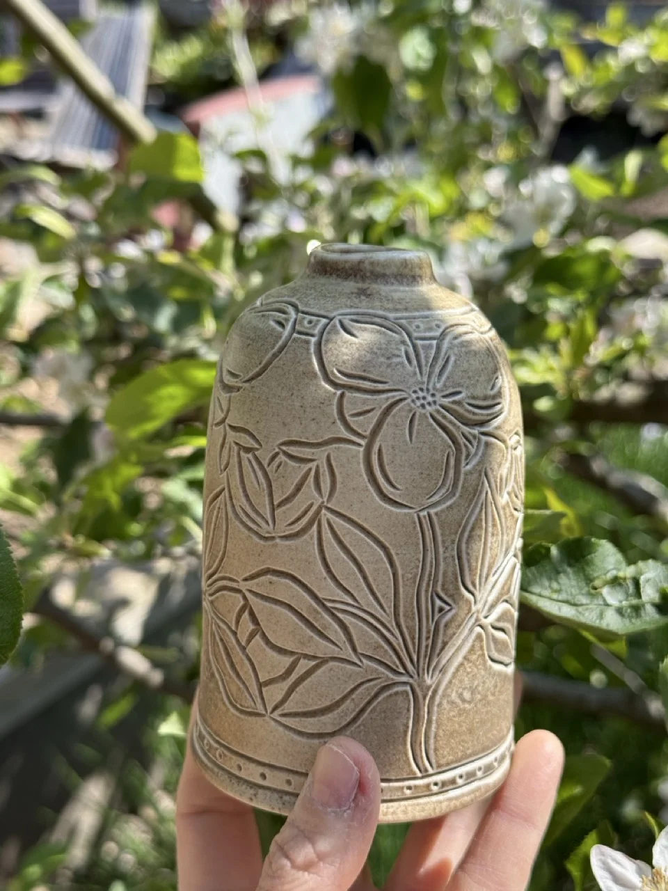 Small jug with flowers carvings